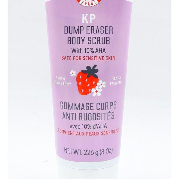 First Aid Beauty KP Bump Eraser Strawberry Body Scrub 8 oz tube, purple with strawberry graphic.