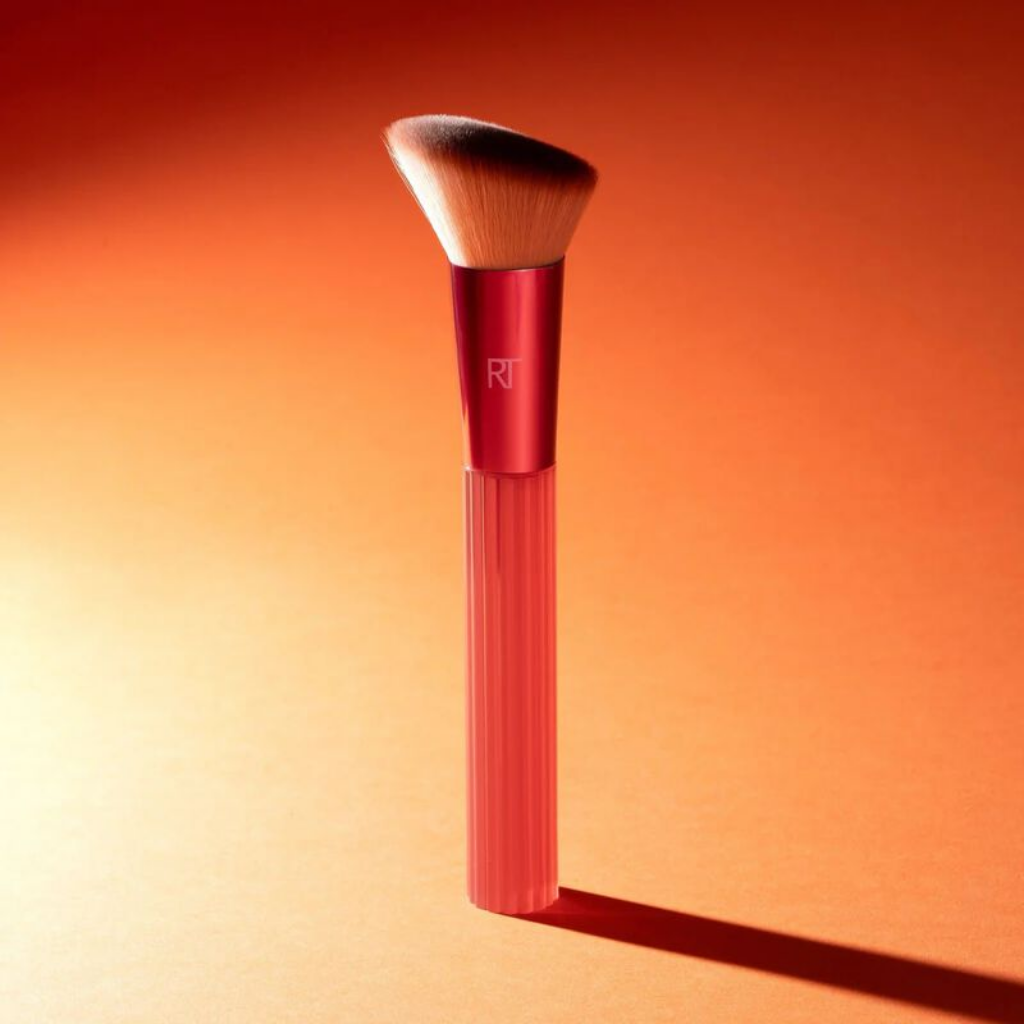 Solar Power 103 brush standing against a warm orange background