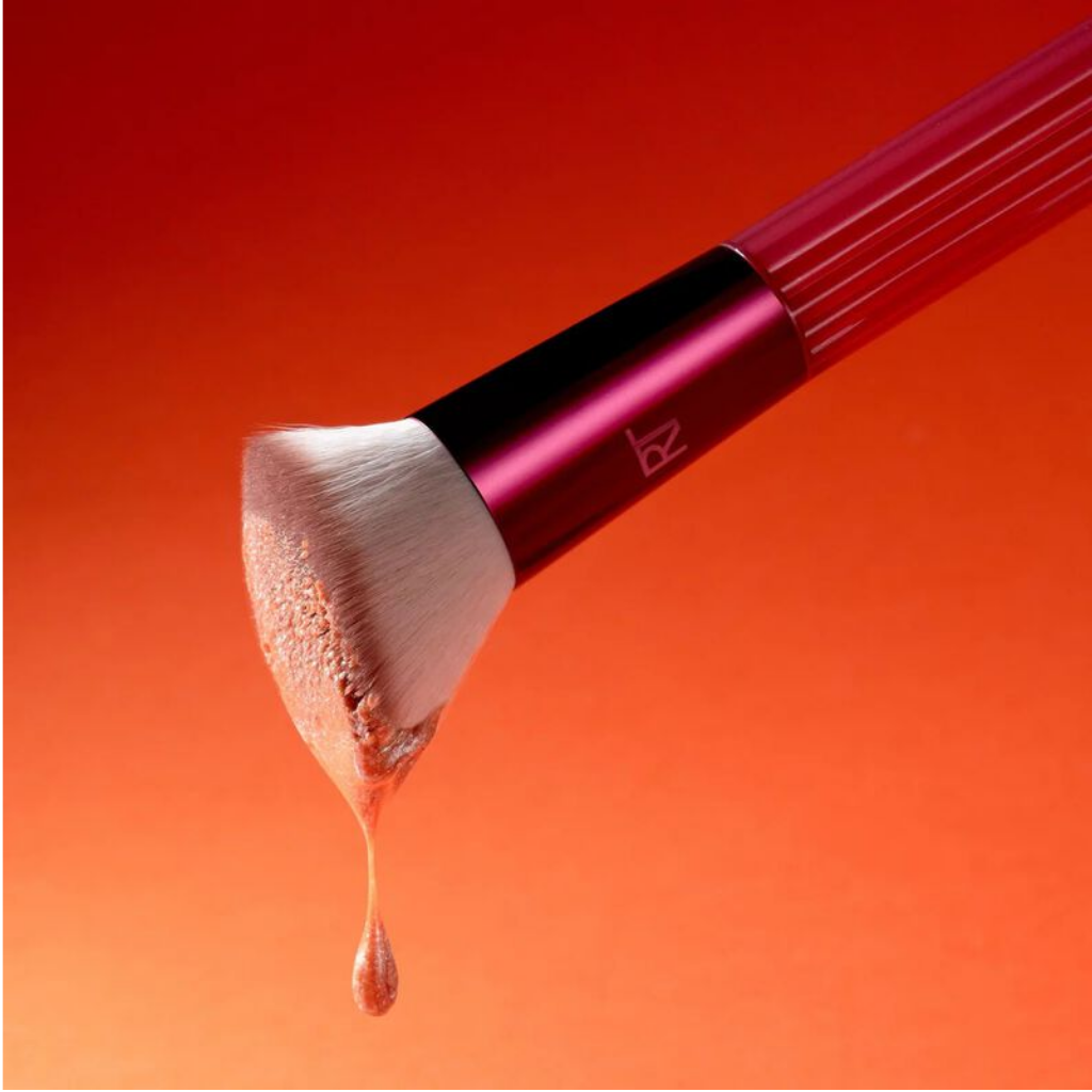 Close-up of Solar Power 103 brush bristles with a liquid makeup swatch