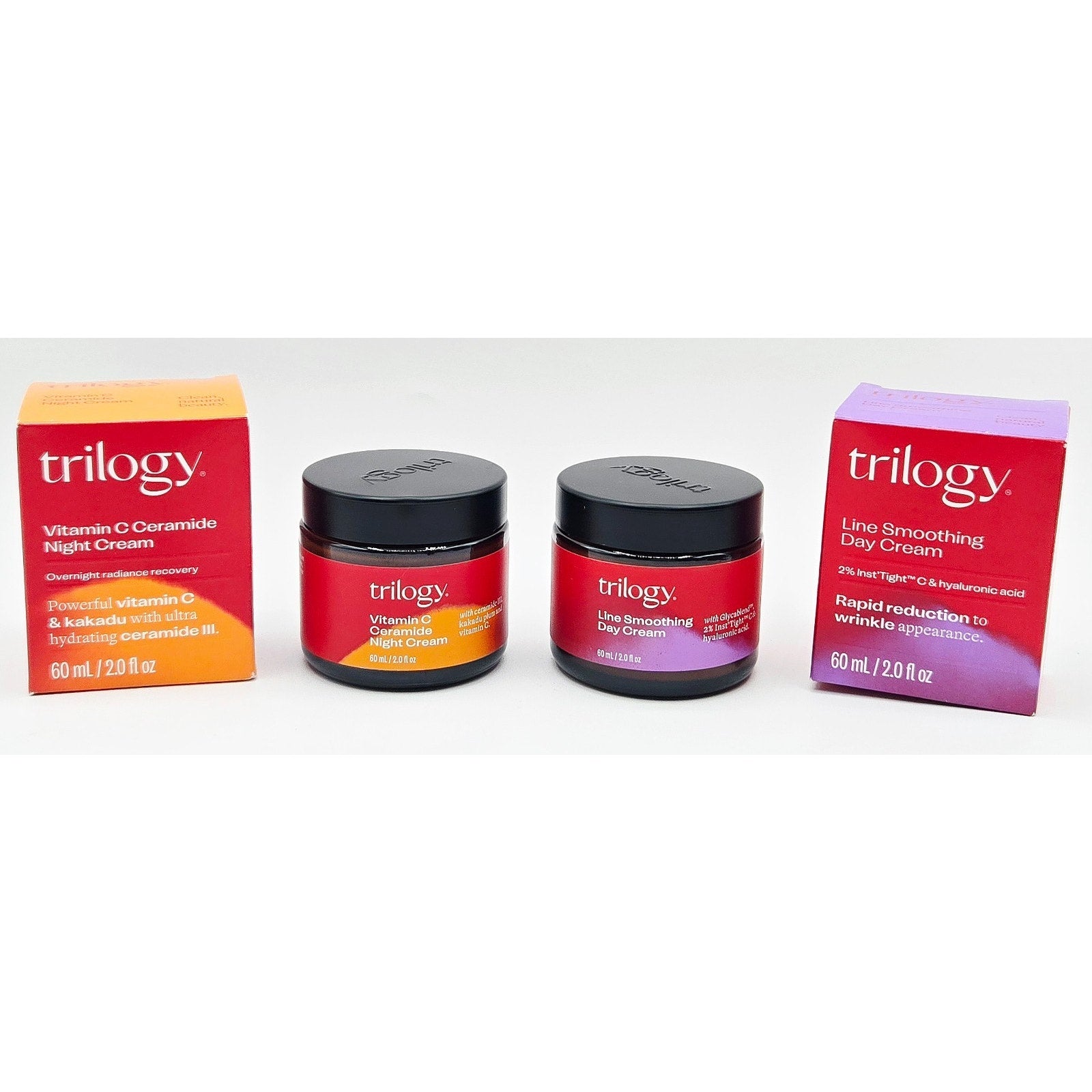 Trilogy skincare products including jars and boxes on a white background