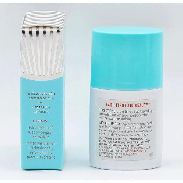 First Aid Beauty Bronze + Glow Drops bottle with a light blue cap next to its white and blue striped box.