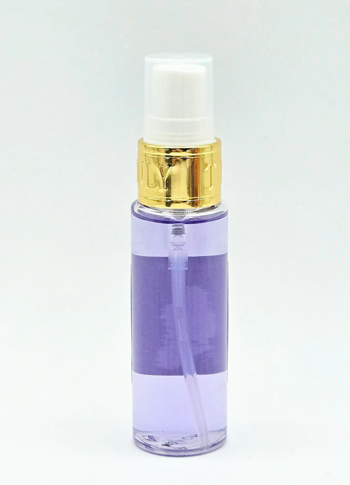 Purple pump bottle with gold trim on white background