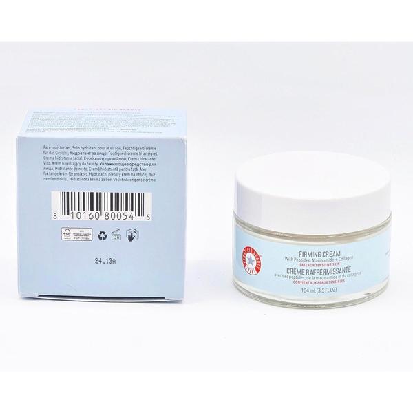 First Aid Beauty Firming Cream 3.5 fl oz in a clear jar with a white lid, next to its light blue box.