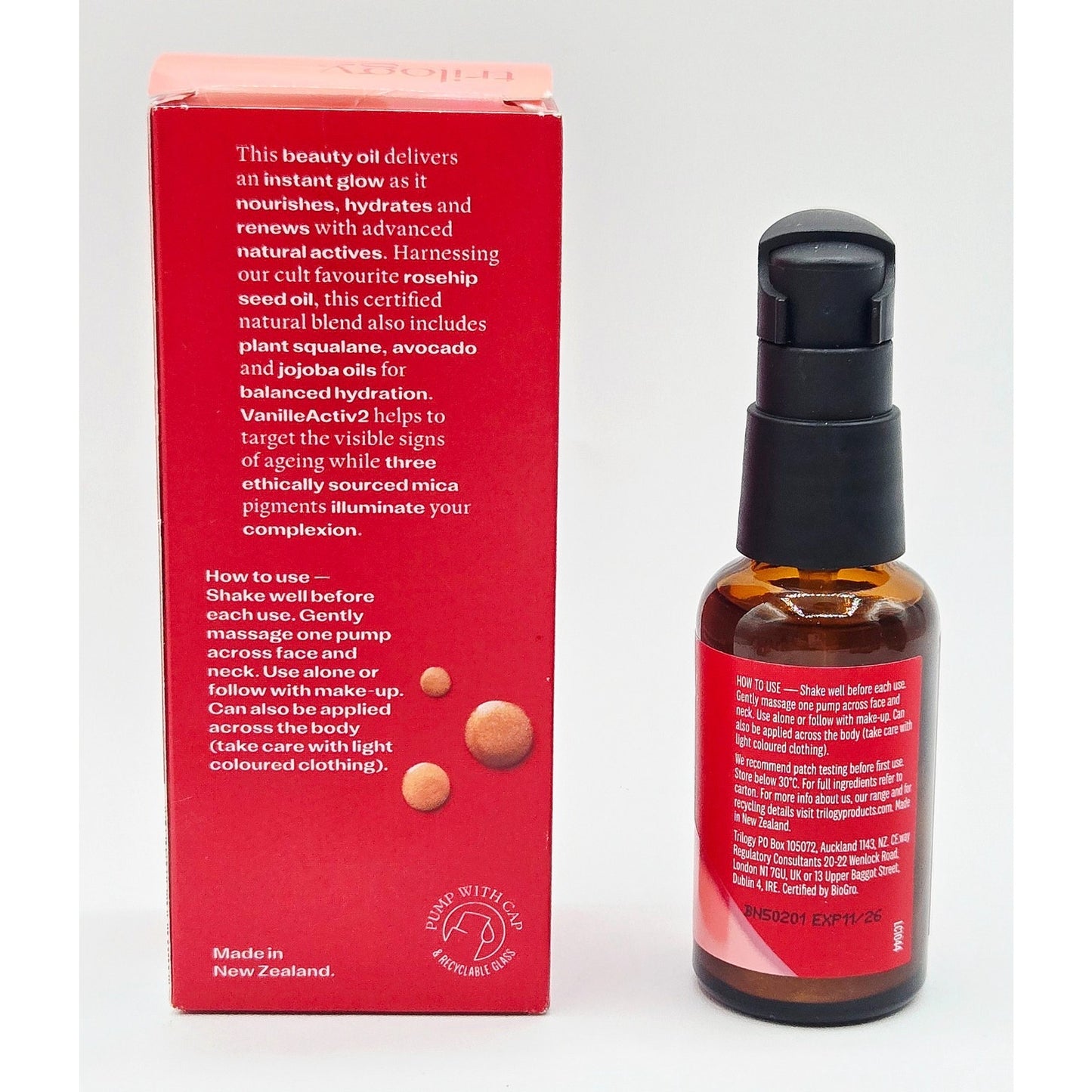 Skincare serum bottle with red packaging on a white background