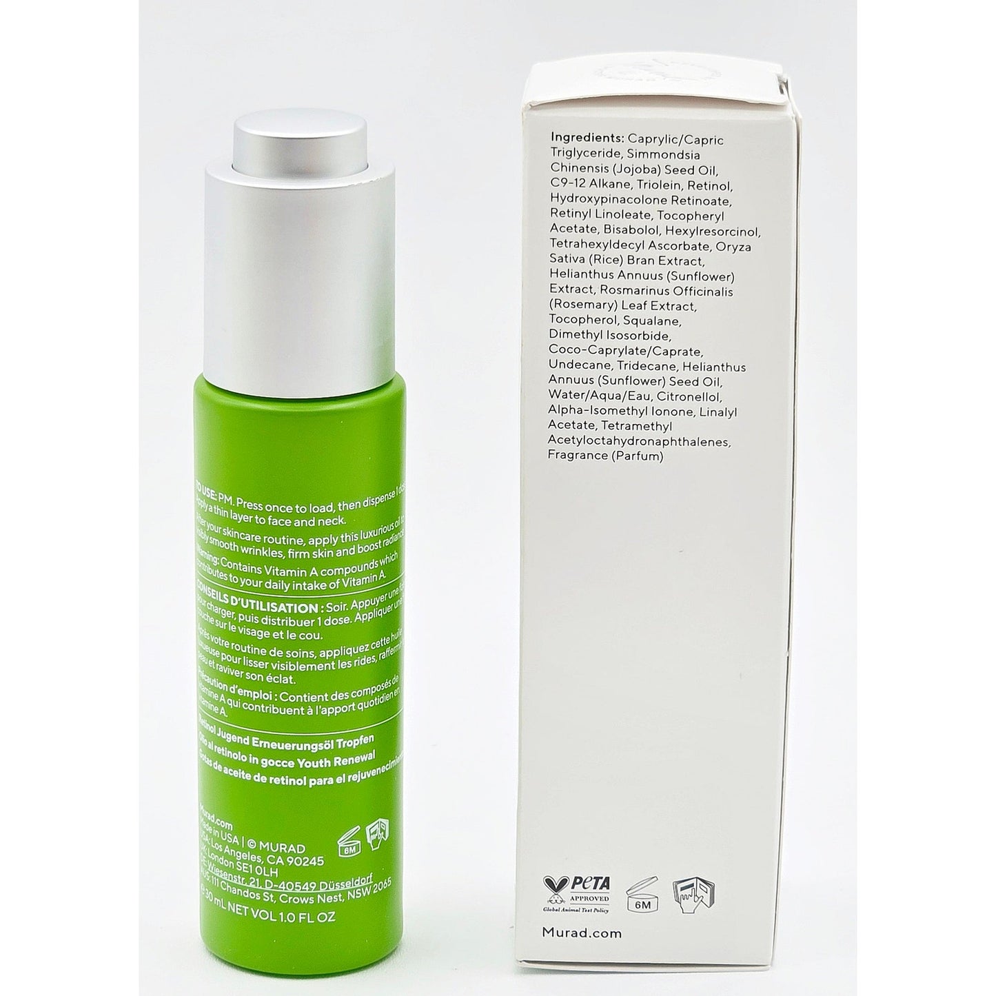 Murad Retinol Youth Renewal Oil Drops bottle beside full ingredient panel