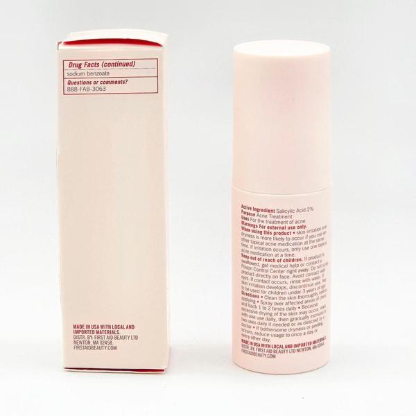 First Aid Beauty Body Acne Clearing Mist, a tall, light pink bottle with a white cap, next to its white and pink box.