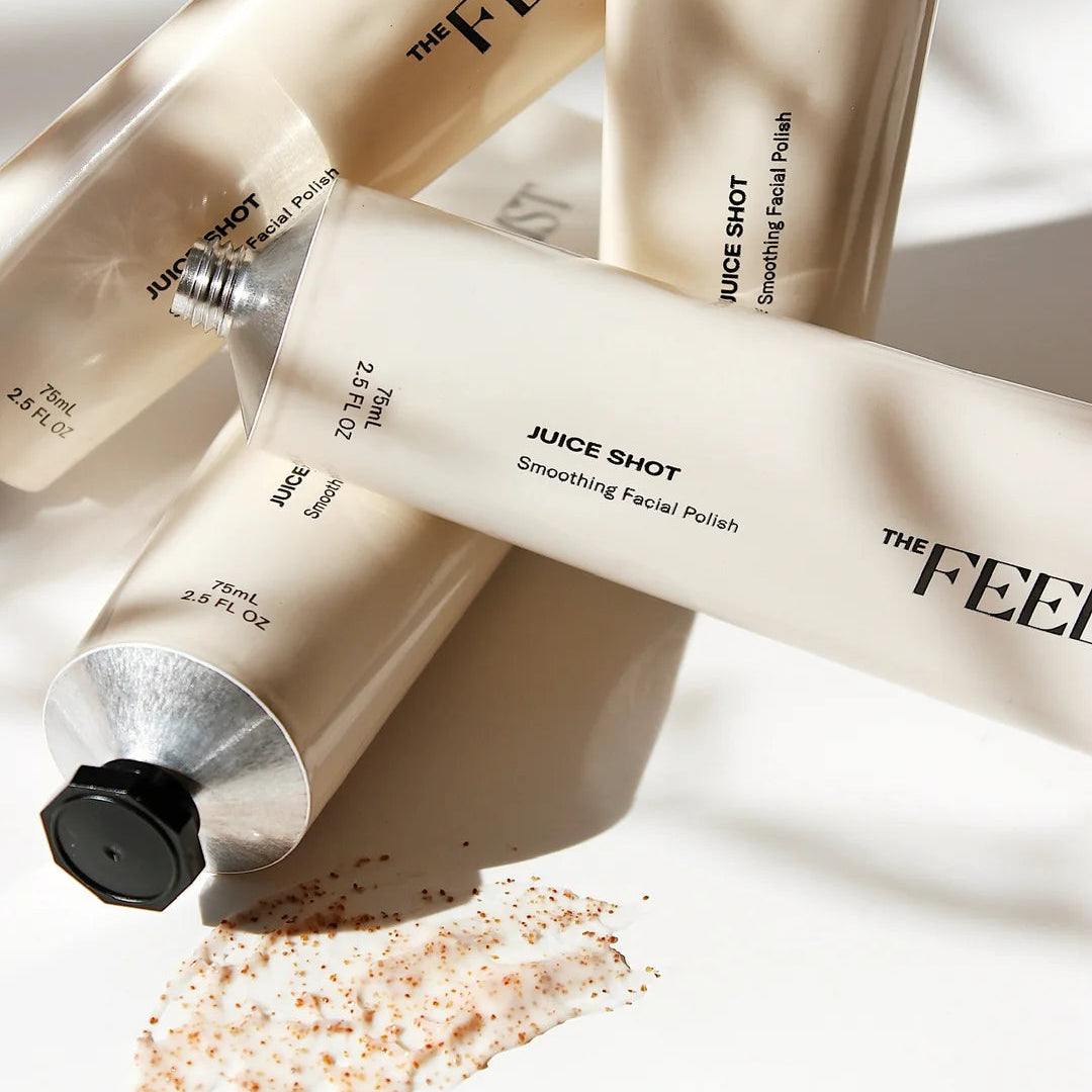 The Feelist Juice Shot tubes arranged beside a grainy polish swatch