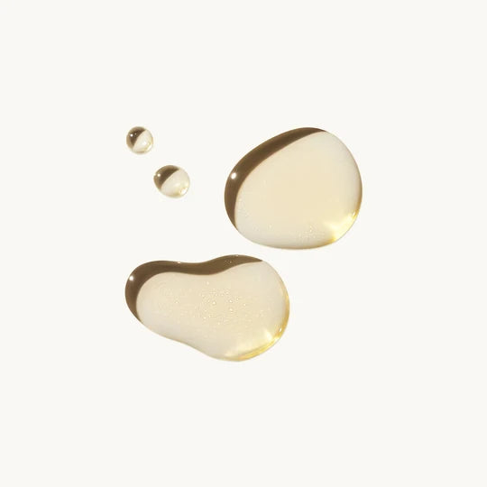 Golden Resurfacing + Hydrating Serum texture droplets on a white background