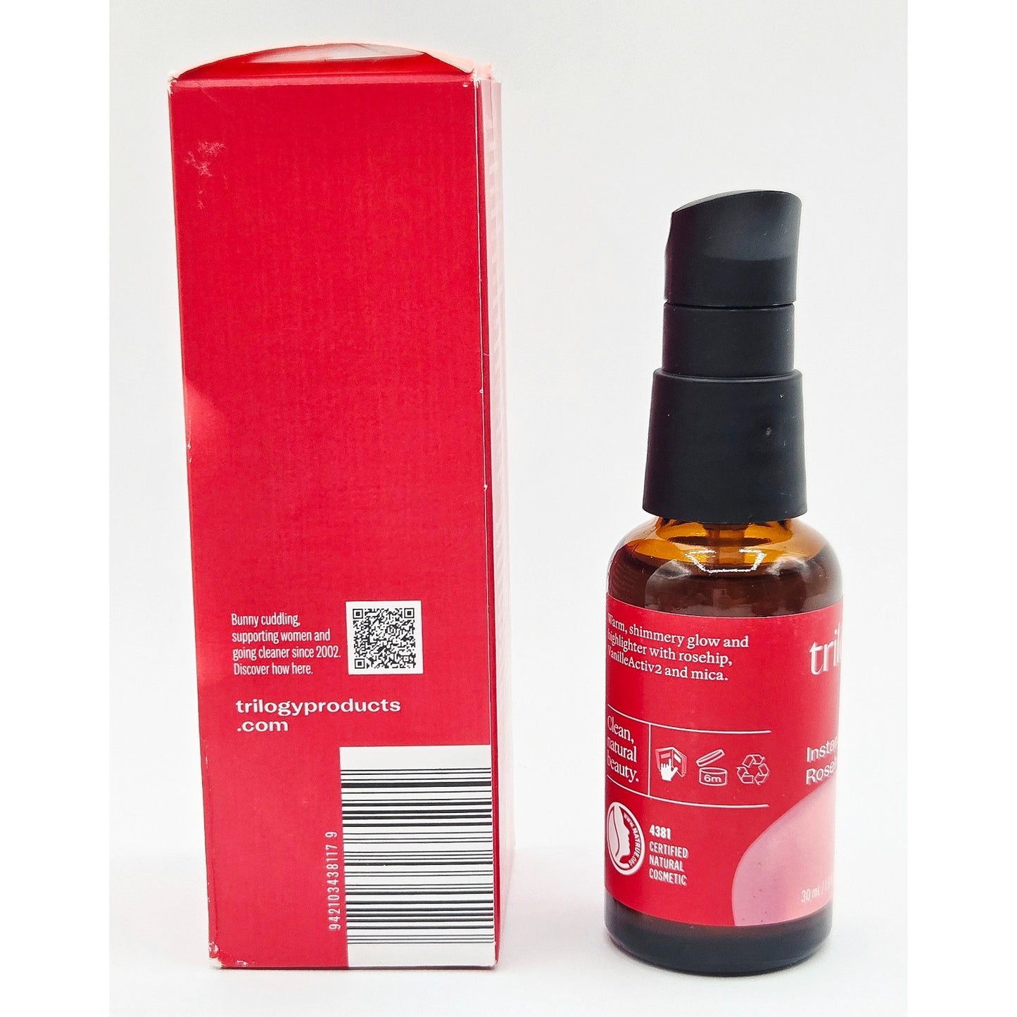Red bottle and box with a black cap on a white background