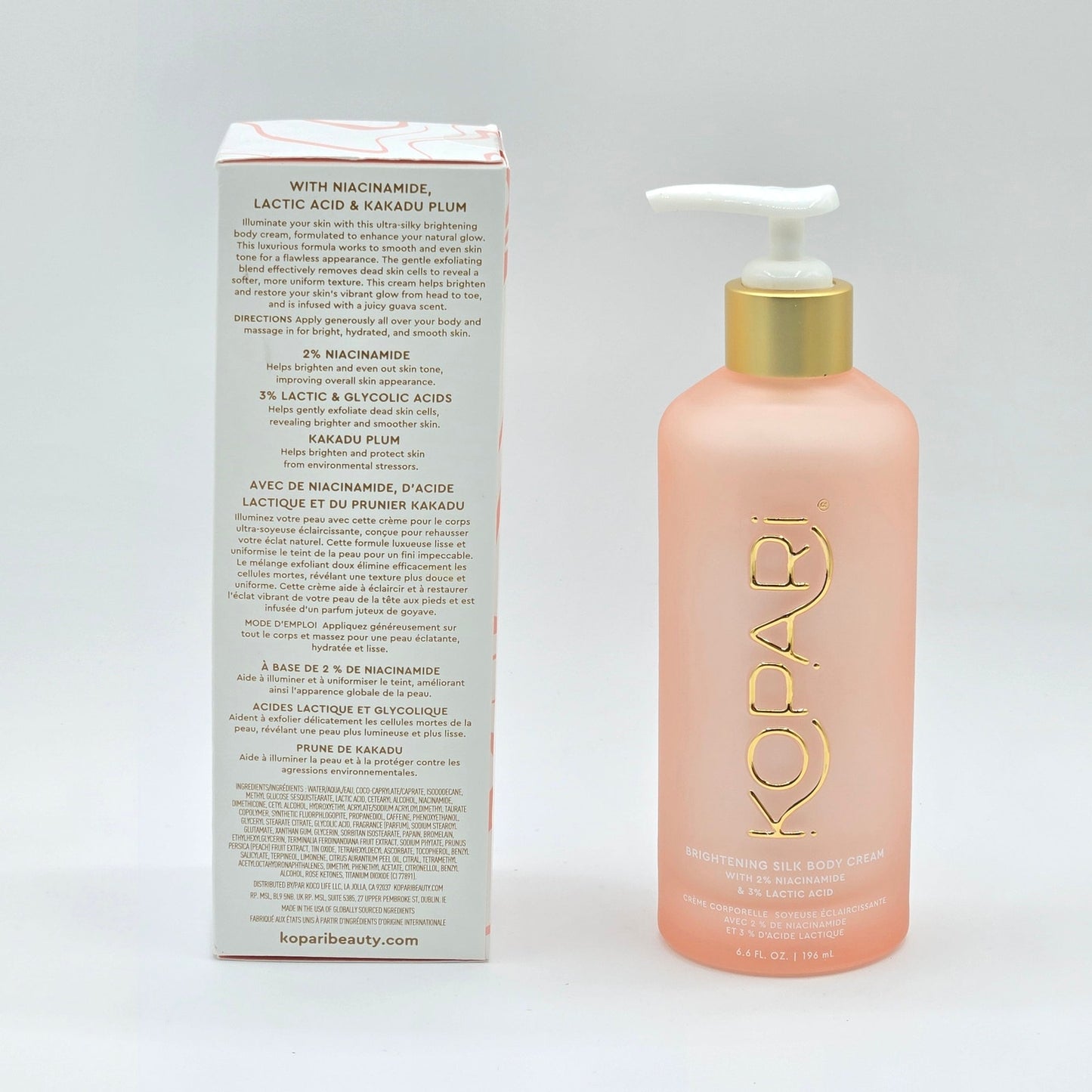 Rear label of Kopari Brightening Silk Body Cream box beside the 6.6 fl oz glass pump bottle