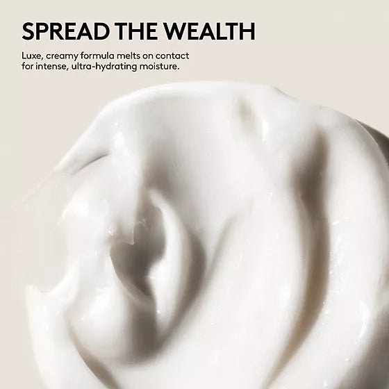 Close-up of The Richer One deep conditioner's thick white cream, highlighting its rich, moisturizing texture.