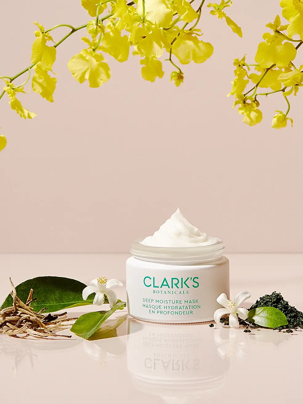 Open jar of Clark's Botanicals Deep Moisture Mask with botanical ingredients