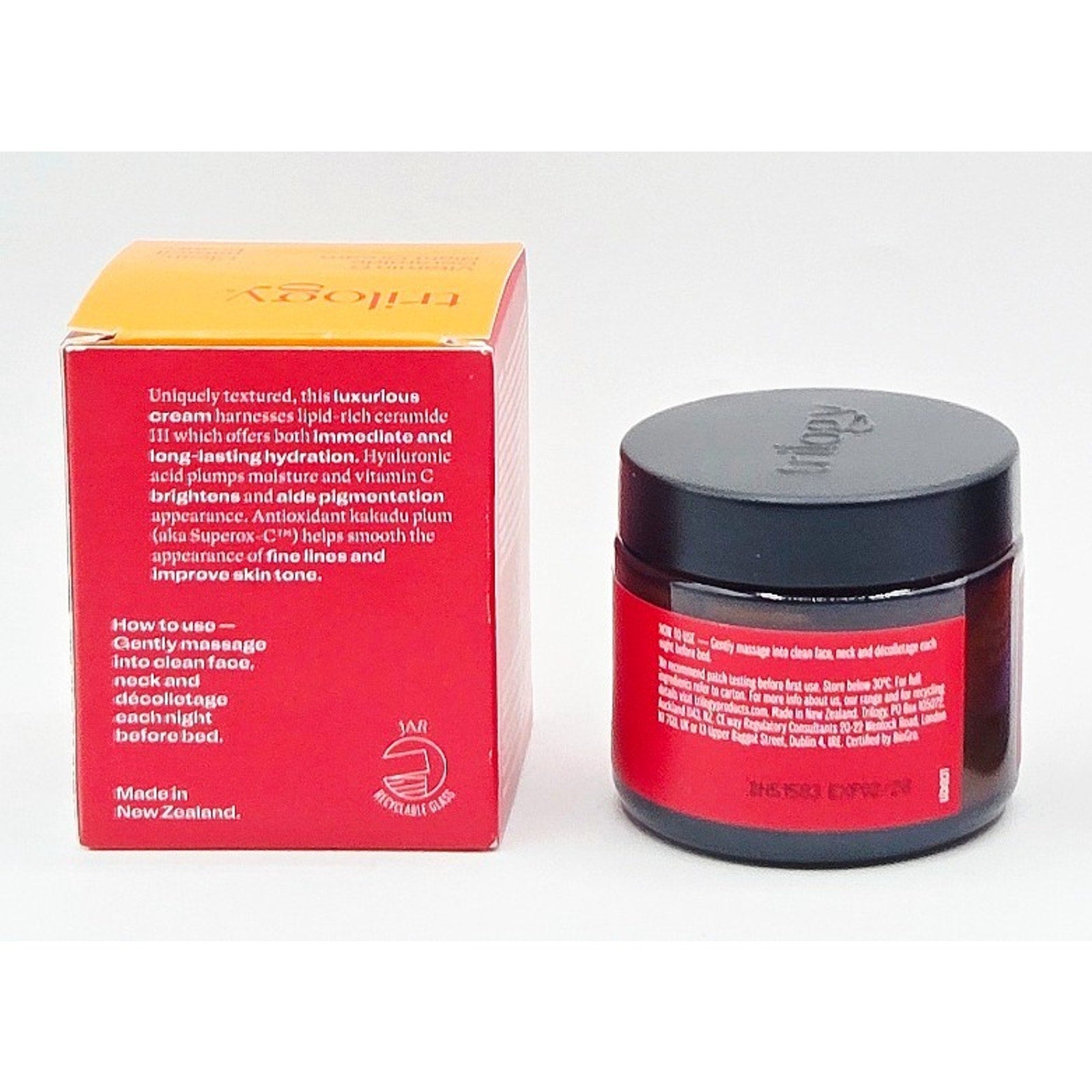 Red jar and yellow box with black lid on a white background