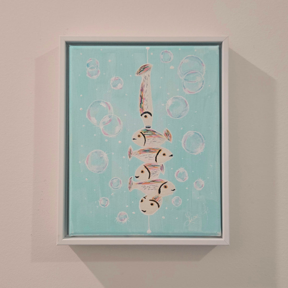 Fish Fun in Bubbles original acrylic painting displayed in its white frame on a wall