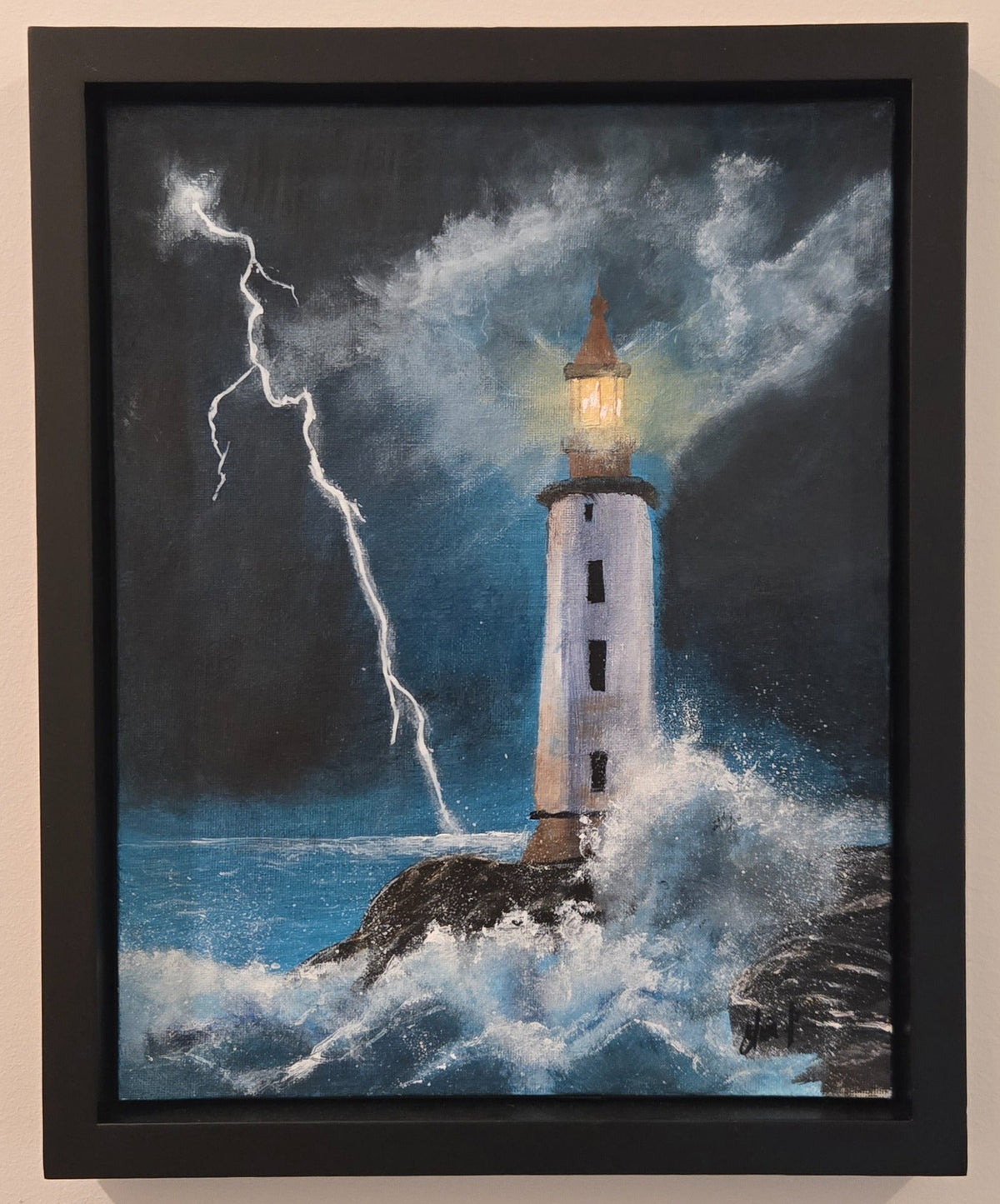Night Light original acrylic lighthouse painting displayed straight on in its black frame