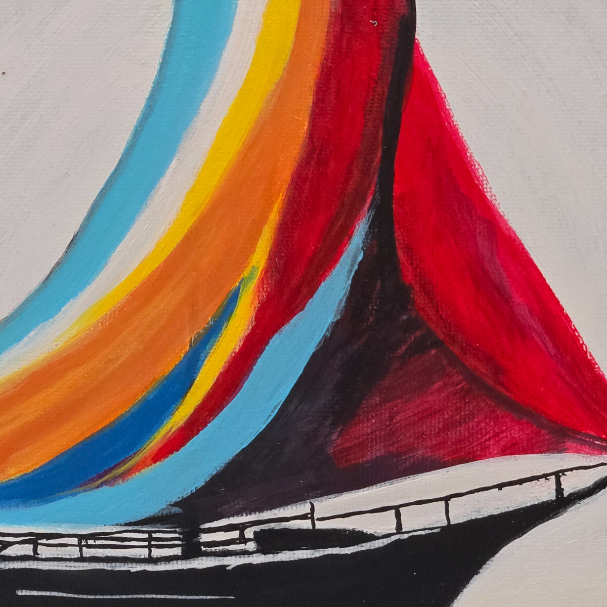 Detail of the vivid red sails, curved mast, and boat railing in Painted Sails