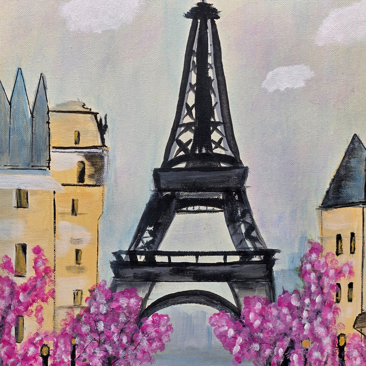 Detail of the Eiffel Tower, Paris buildings, and pink blossoms in Paris in Pink