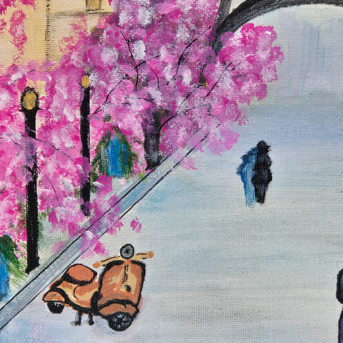 Detail of pink flowering trees, street lamps, and an orange scooter in Paris in Pink