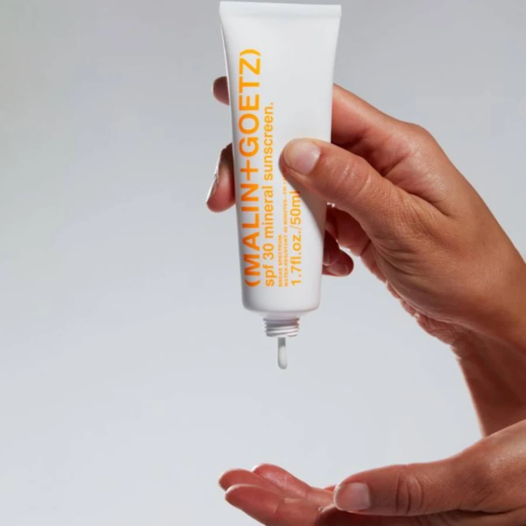 MALIN+GOETZ SPF 30 Mineral Sunscreen tube dispensing gel-cream texture
