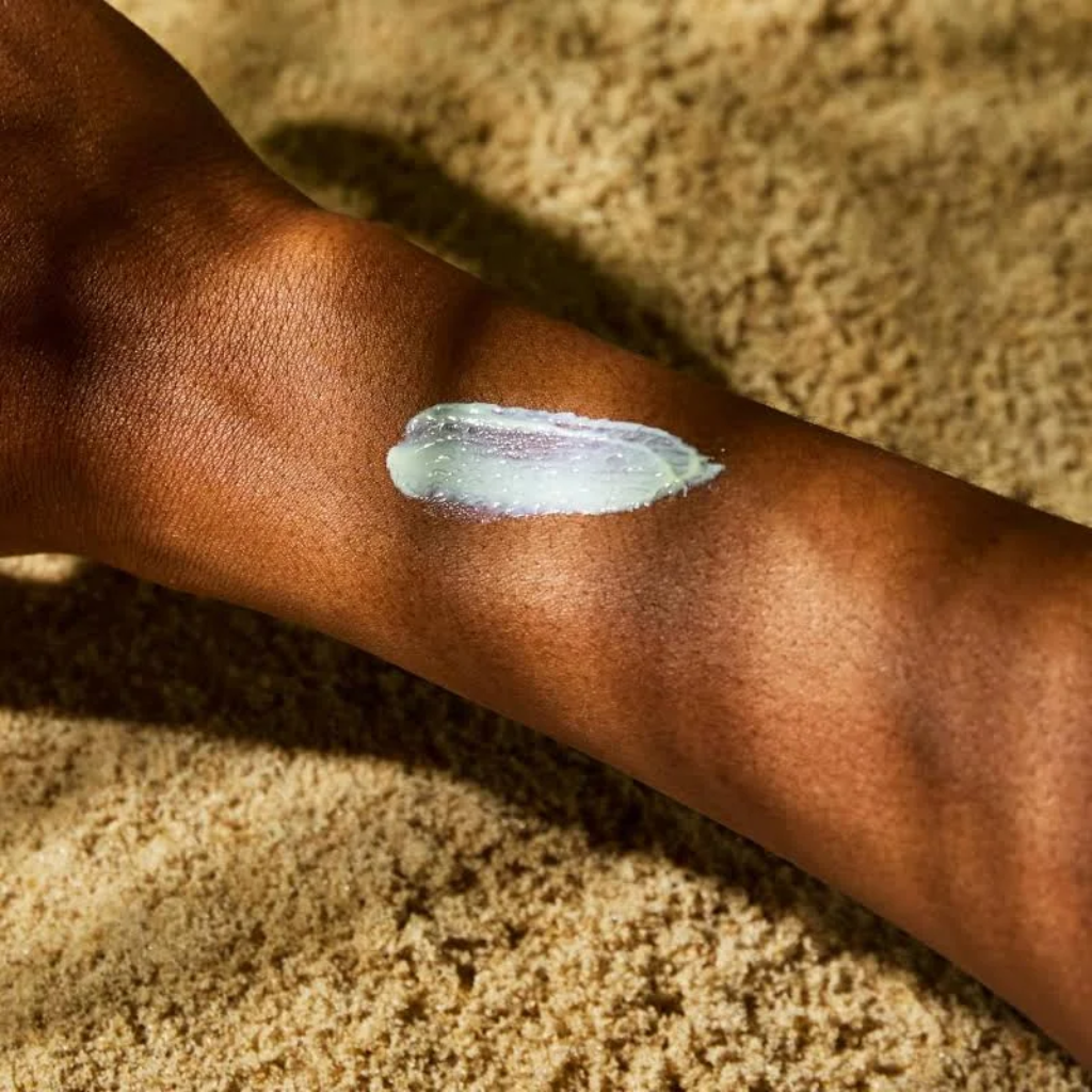 MALIN+GOETZ SPF 30 Mineral Sunscreen swatch on deep skin tone