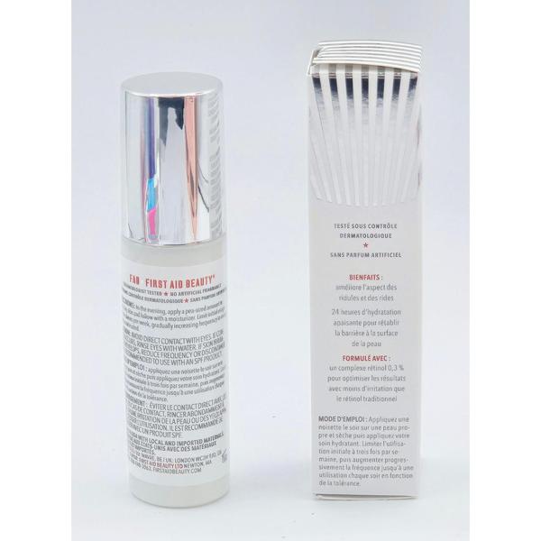 First Aid Beauty 0.3% Retinol Complex Serum in a white bottle with a silver pump next to its white box.