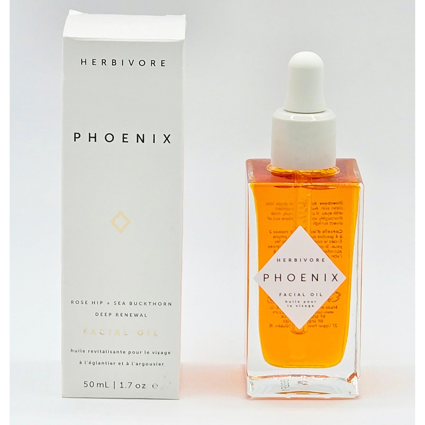 Herbivore Phoenix Deep Renewal Facial Oil 1.7 oz in a clear square bottle with a white dropper, next to its white box.
