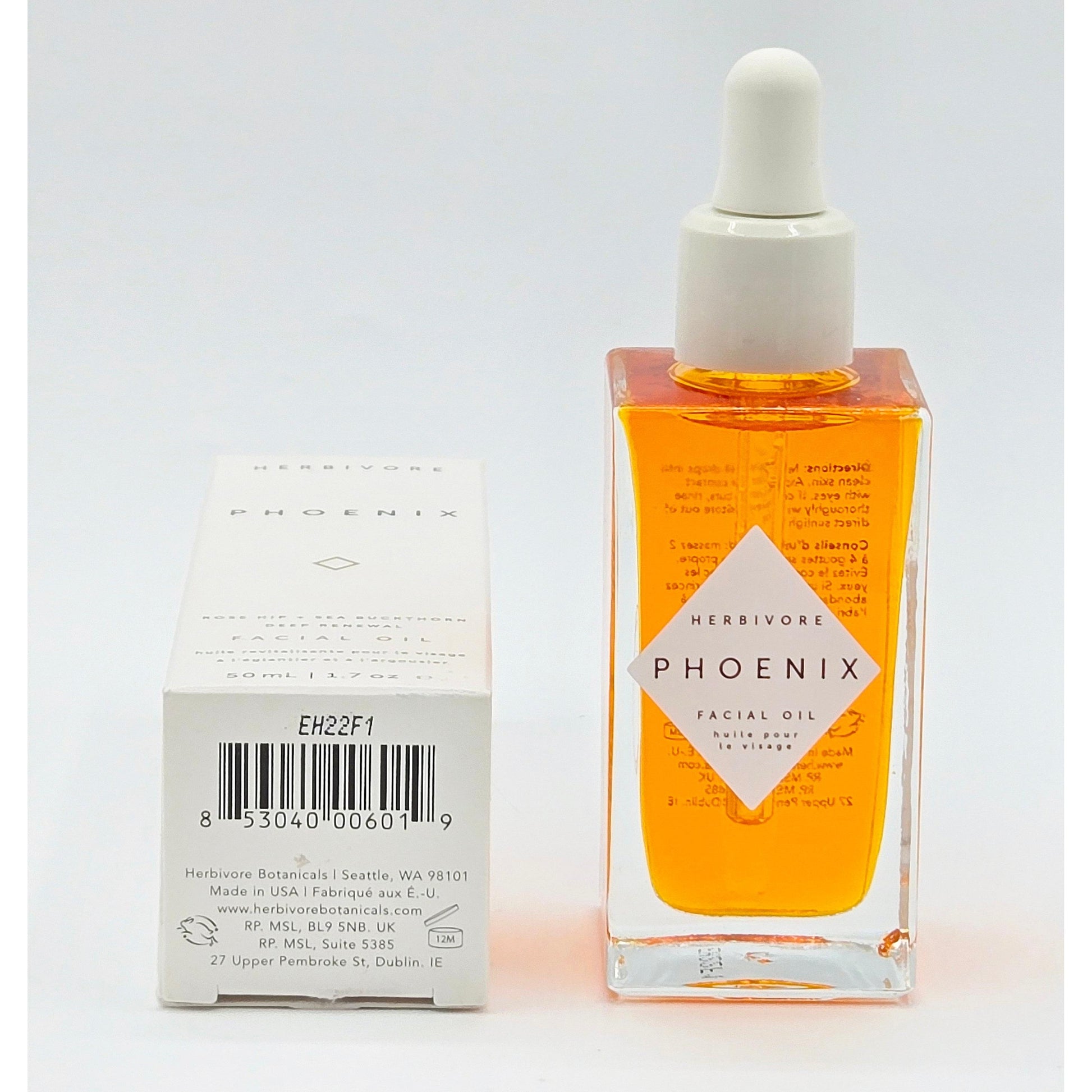 Herbivore Phoenix Deep Renewal Facial Oil 1.7 oz in a clear square bottle with an orange serum and white dropper, next to its white box.