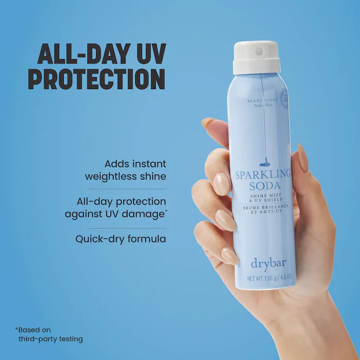 Hand holding Drybar Sparkling Soda Shine Mist & UV Shield beside claims of weightless shine, all-day UV protection and quick drying