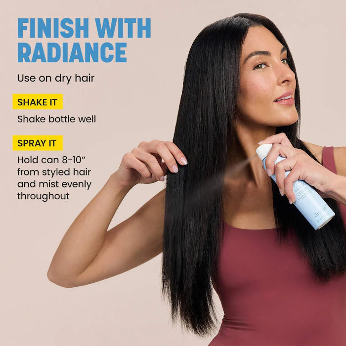 Model misting dry hair with Drybar Sparkling Soda; directions to shake well and spray evenly from 8–10 inches away