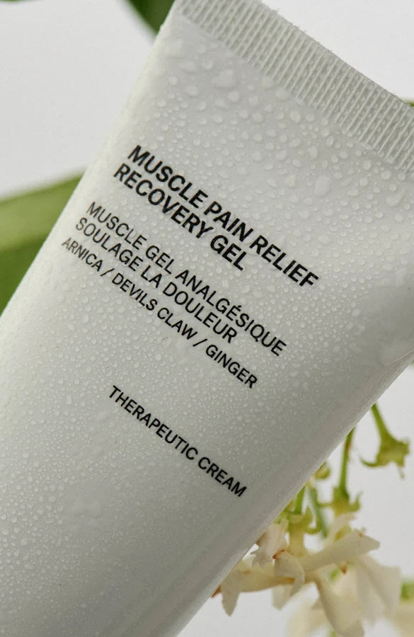 African Botanics Recovery Gel label close-up with water droplets and flowers