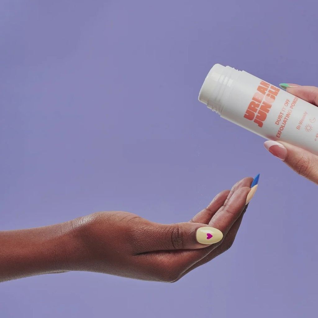Urban Jungle Dust It Off Exfoliating Powder being sprinkled into a hand.